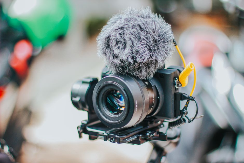 Close-up of a camera with microphone perfect for video recording or vlogging.