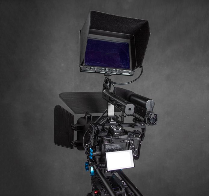 Close-up of a professional camera rig with monitor, ideal for filmmaking.