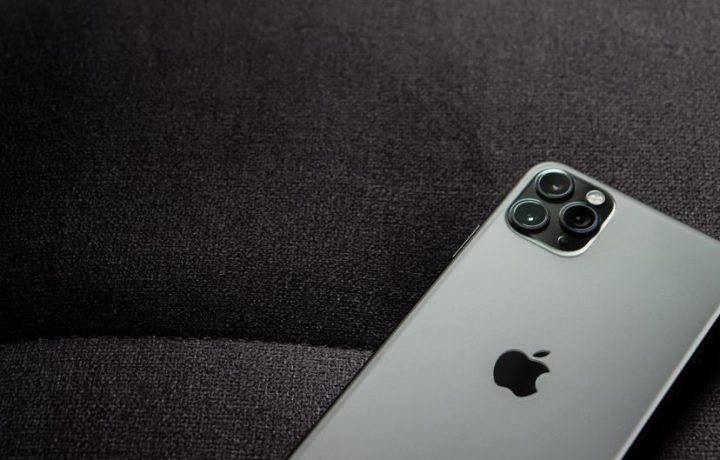 Close-up of a smartphone highlighting its modern design on a dark background.