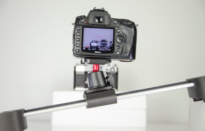 Camera on a stabilizer capturing a clean studio setup with precision.