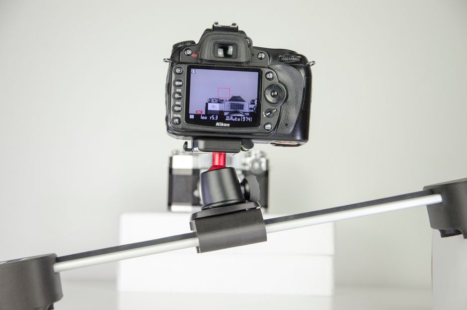 Camera on a stabilizer capturing a clean studio setup with precision.