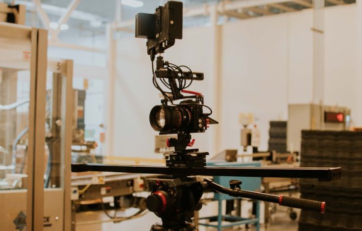 Detailed view of a camera rig set up for professional filming inside a studio setting.