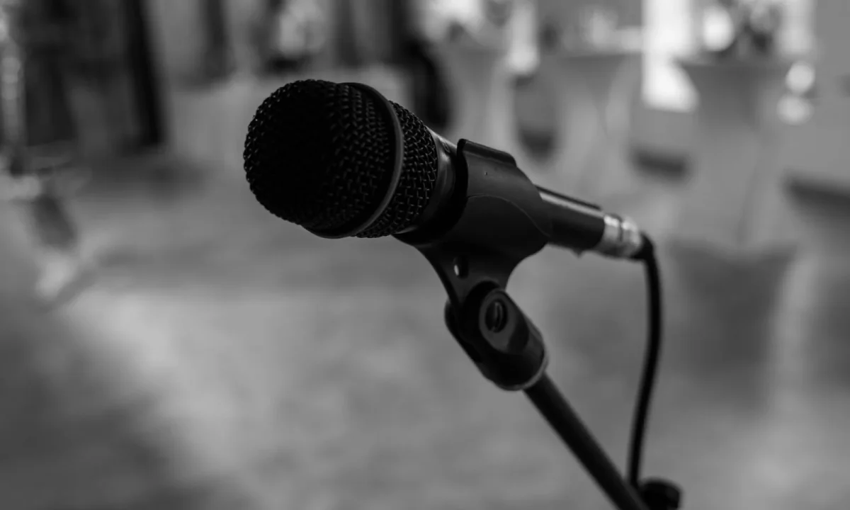 Close-up of a textured microphone in a studio, symbolizing teleprompter efficiency techniques in audio production
