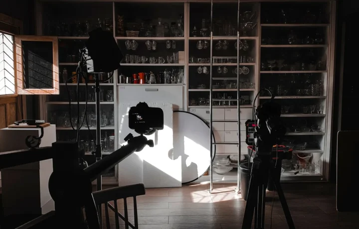 A photography studio set with cameras and lights, showing how on-camera confidence starts with a prepared space