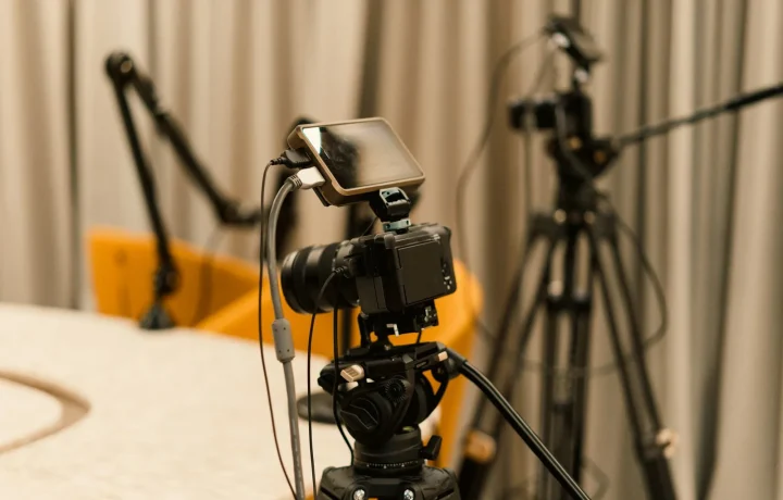 A professional studio setup featuring cameras and microphones for effective live streaming teleprompter use