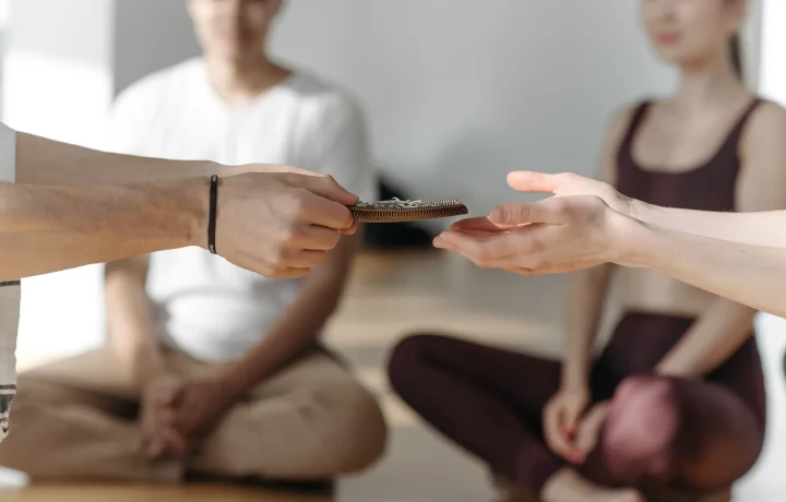 A serene group practicing mindfulness with beads, illustrating techniques for overcoming anxiety