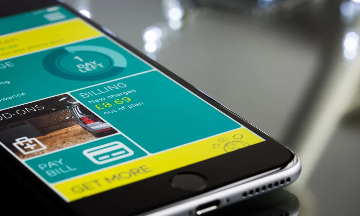 A smartphone showcasing a teleprompter app comparisons interface on a sleek reflective surface