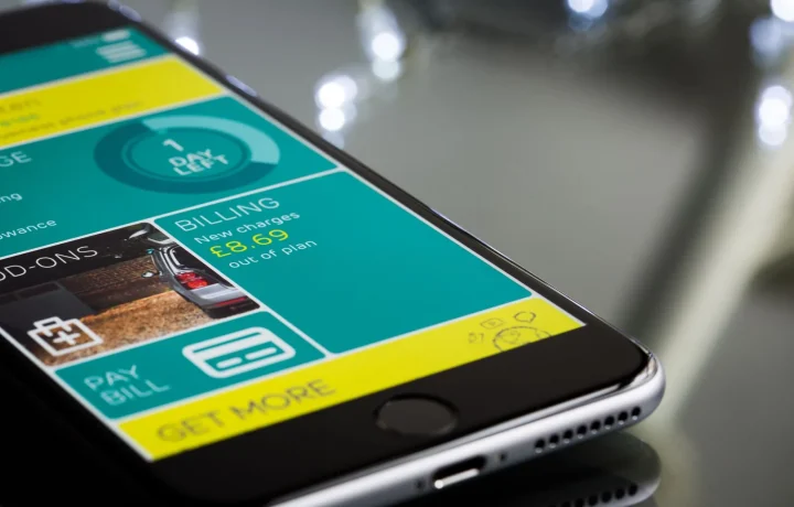 A smartphone showcasing a teleprompter app comparisons interface on a sleek reflective surface