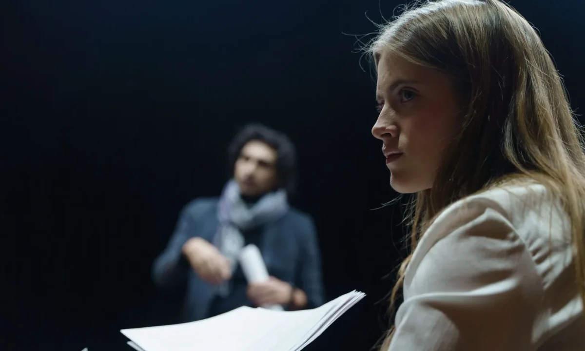 Actors rehearsing a scene, illustrating script writing for teleprompters in a theater