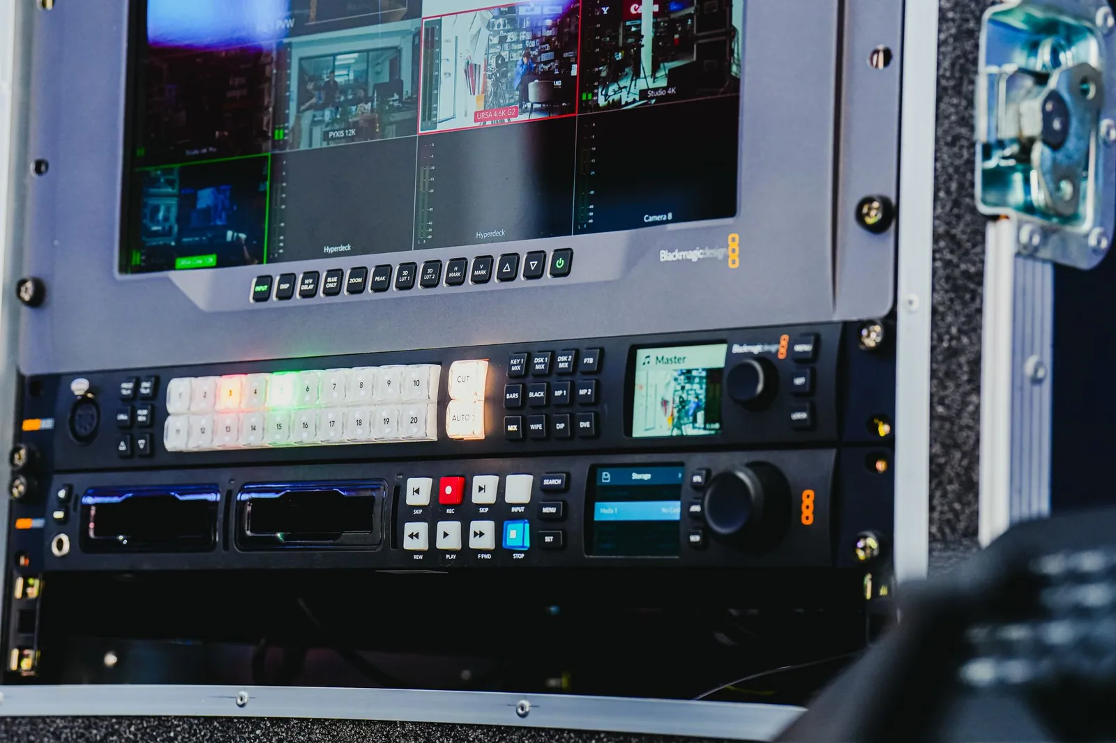 Advanced video editing setup with multiple screens, highlighting the role of teleprompters in education