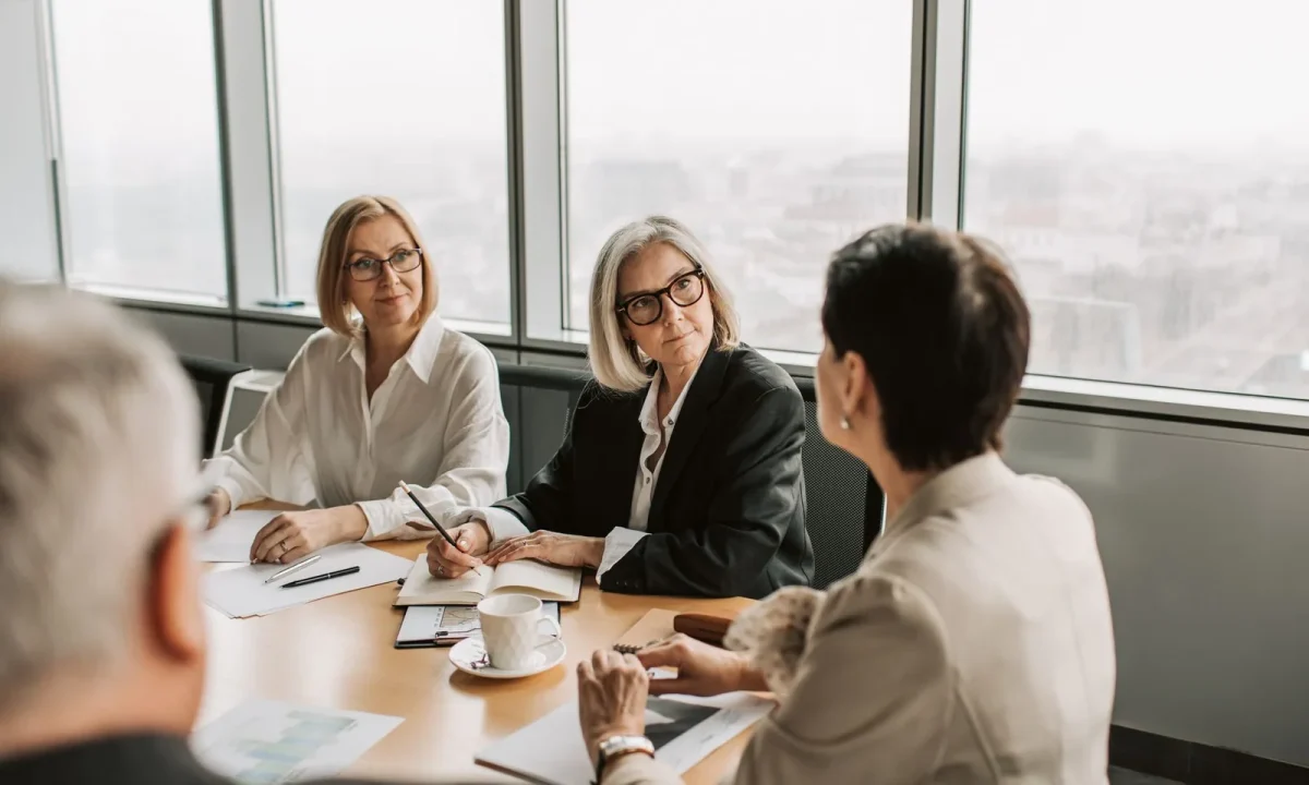 Business professionals collaborating on engagement strategies during a strategy meeting in a modern office
