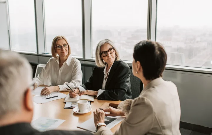 Business professionals collaborating on engagement strategies during a strategy meeting in a modern office