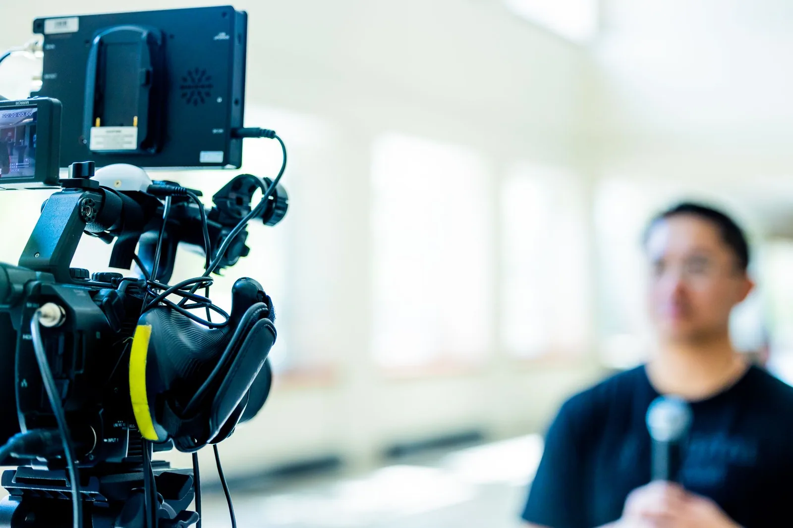 Camera setup focused on an interview subject blurred in the background during key teleprompter technology trends