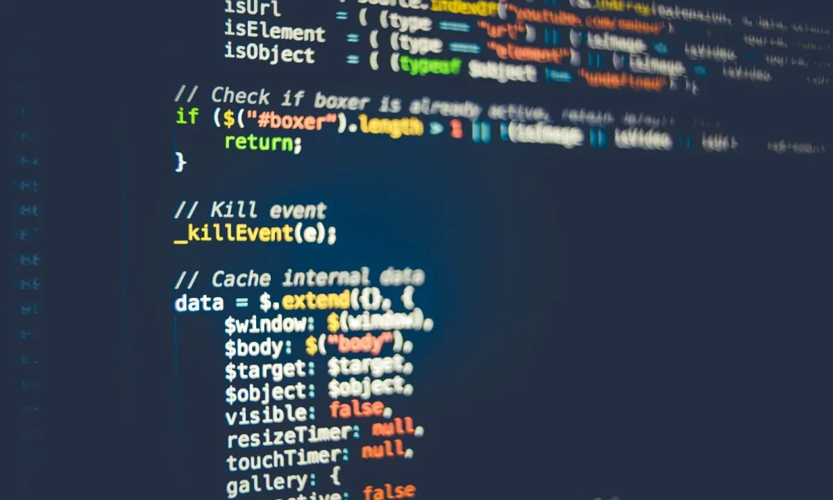 Colorful programming code on a computer screen backing teleprompter app comparisons for developers