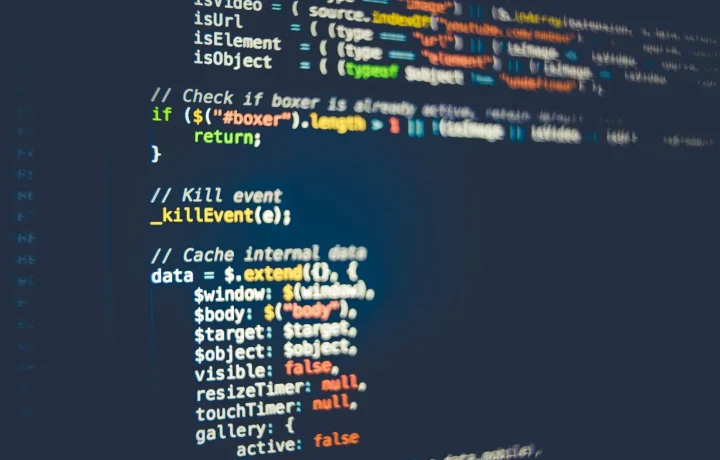 Colorful programming code on a computer screen backing teleprompter app comparisons for developers
