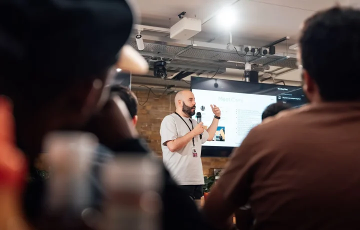 Engaging speaker presenting at a tech event, showcasing the future of teleprompters in action