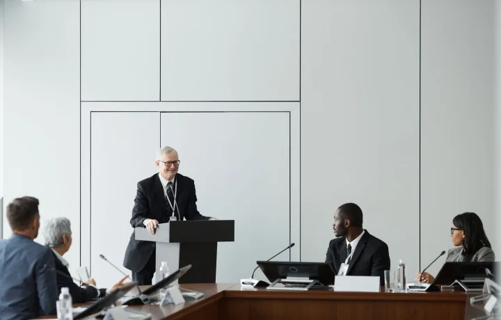 Engaging speaker using audience engagement teleprompters during a formal business meeting in a conference room
