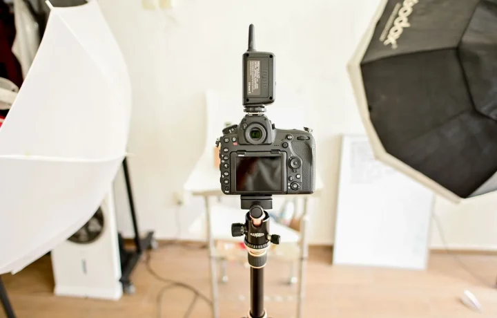 Professional DSLR camera setup in a studio, highlighting key elements for choosing teleprompter options