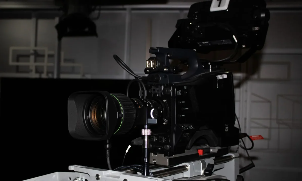 Professional video camera rig in a studio showcasing a teleprompter for video formats setup