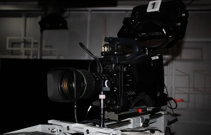 Professional video camera rig in a studio showcasing a teleprompter for video formats setup