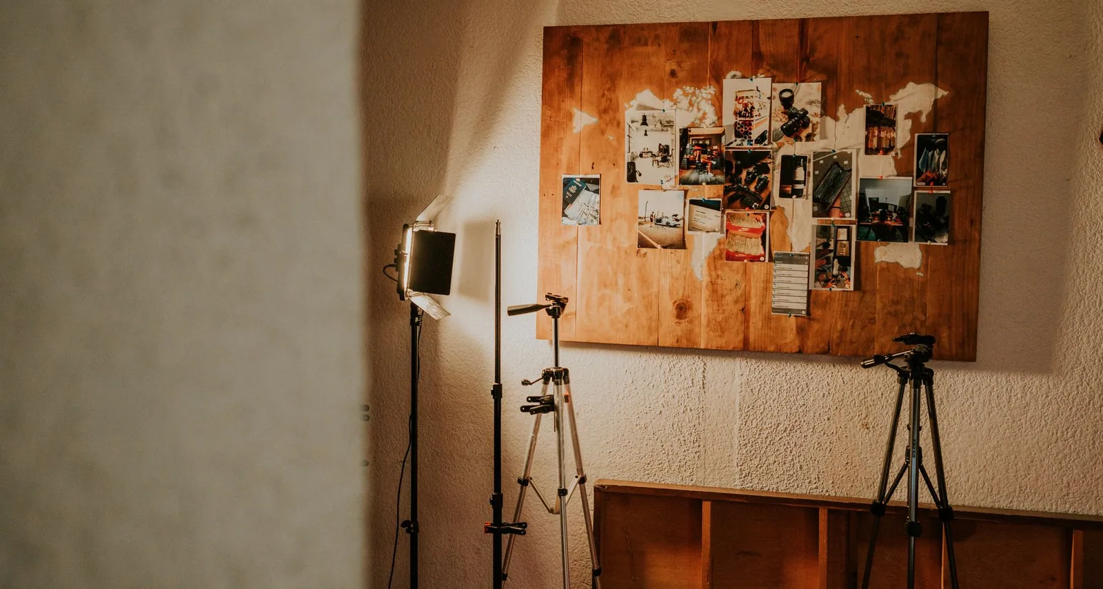 Studio corner with lighting gear and an inspiration board, supporting the mental prep needed before recording